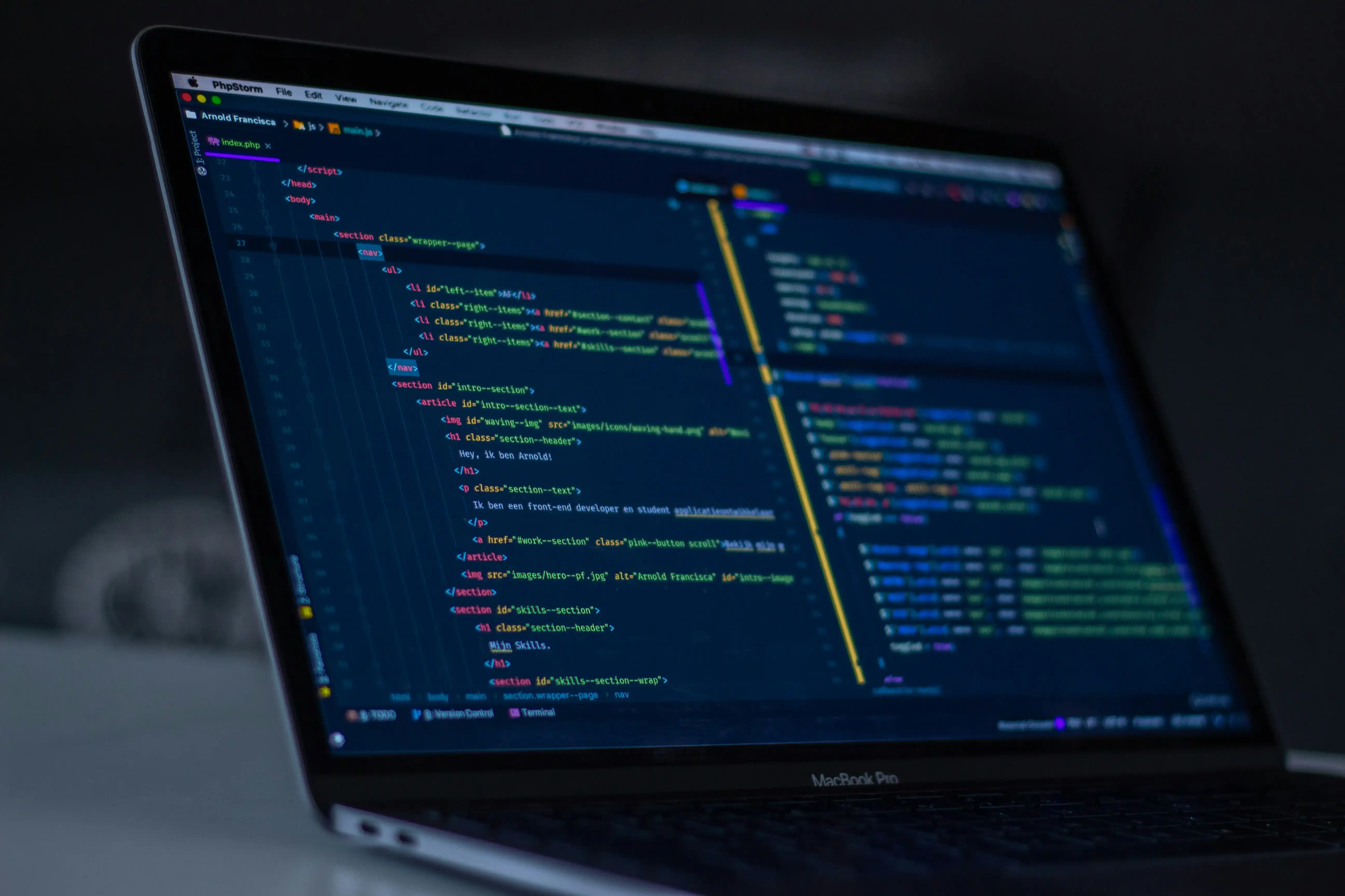 Developer workspace with code editor showing JSON-LD schema markup for Article and FAQ structured data with syntax highlighting